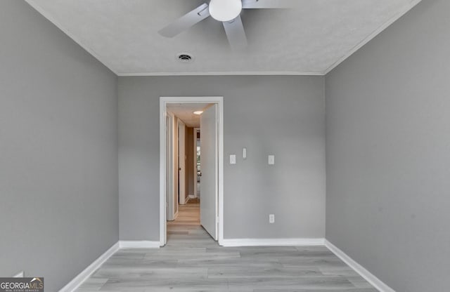 1094 SW Amber Rdg SW, Lilburn, GA 30047 - empty room featuring ceiling fan, ornamental molding, and light wood-type flooring