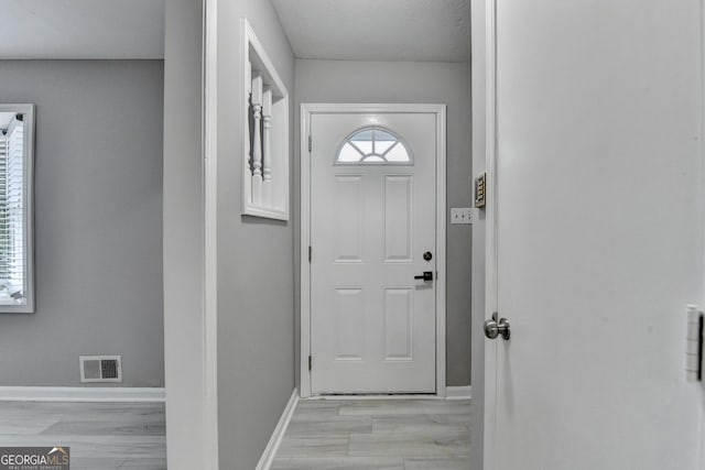 1094 SW Amber Rdg SW, Lilburn, GA 30047 - doorway featuring light wood-style flooring and baseboards
