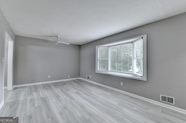 1094 SW Amber Rdg SW, Lilburn, GA 30047 - spare room with a ceiling fan and light wood-type flooring