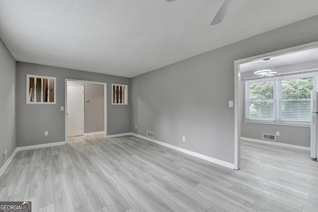1094 SW Amber Rdg SW, Lilburn, GA 30047 - empty room featuring light wood-style flooring and a ceiling fan