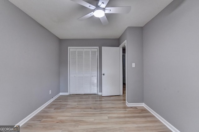 1094 SW Amber Rdg SW, Lilburn, GA 30047 - unfurnished bedroom featuring light wood-style flooring, a closet, and a ceiling fan