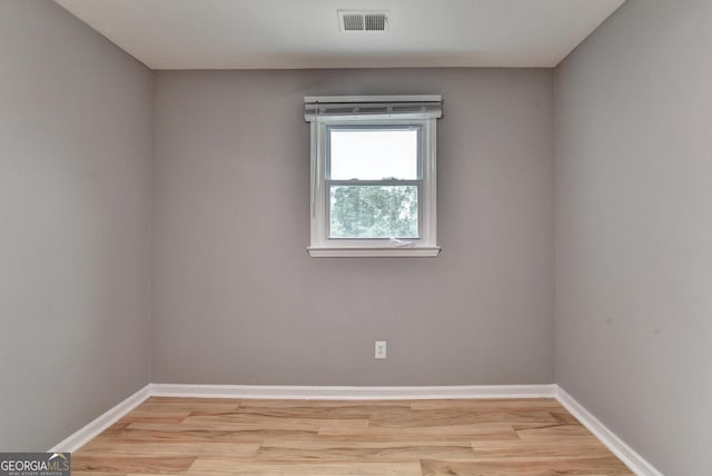 1094 SW Amber Rdg SW, Lilburn, GA 30047 - spare room featuring baseboards and light wood-style floors