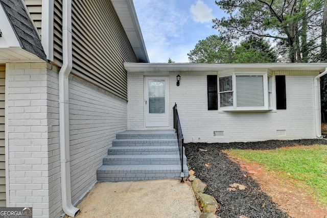 1094 SW Amber Rdg SW, Lilburn, GA 30047 - view of exterior entry featuring crawl space and brick siding