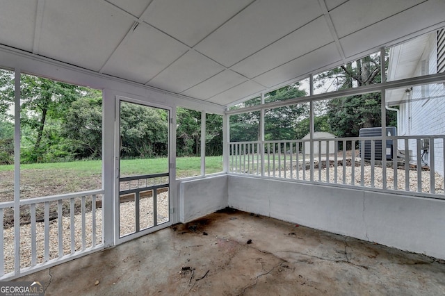 1094 SW Amber Rdg SW, Lilburn, GA 30047 - unfurnished sunroom featuring view of scattered trees