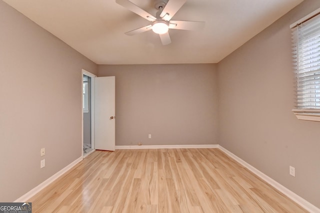 1094 SW Amber Rdg SW, Lilburn, GA 30047 - unfurnished room with light wood finished floors and a ceiling fan