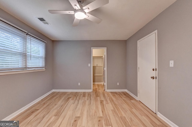 1094 SW Amber Rdg SW, Lilburn, GA 30047 - unfurnished room with a ceiling fan and light wood finished floors