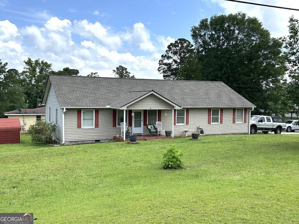 2557 Bartley Rd, Lagrange, GA 30240 - single story home with covered porch, a shingled roof, and a front lawn