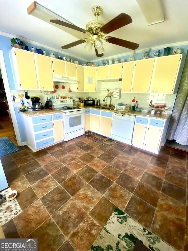 2557 Bartley Rd, Lagrange, GA 30240 - kitchen featuring white appliances, dark stone finish flooring, under cabinet range hood, and cream cabinetry
