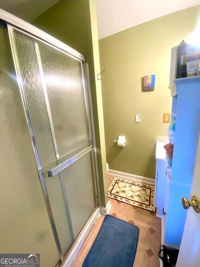 2557 Bartley Rd, Lagrange, GA 30240 - bathroom with vanity, a stall shower, and tile patterned floors