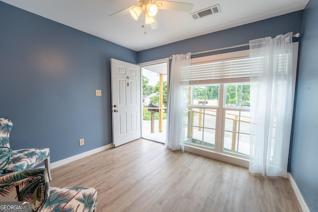 46 Wall Street Way, Toccoa, GA 30577 - living area featuring light wood-style flooring and a ceiling fan