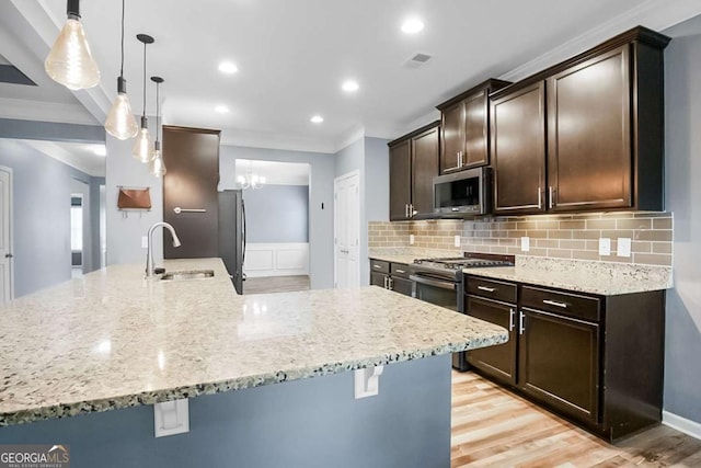 132 Berkleigh Trails Dr, Hiram, GA 30141 - kitchen featuring stainless steel appliances, crown molding, a kitchen bar, dark brown cabinetry, and tasteful backsplash