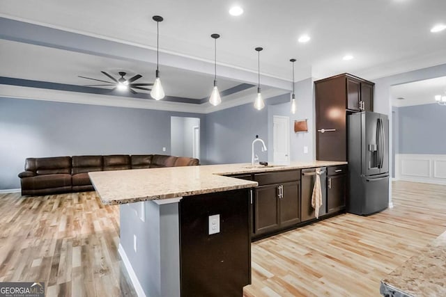 132 Berkleigh Trails Dr, Hiram, GA 30141 - kitchen with appliances with stainless steel finishes, light wood-style flooring, light stone countertops, dark brown cabinets, and ornamental molding