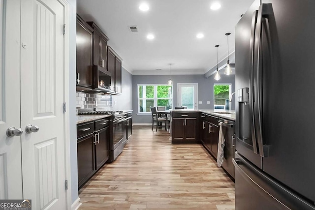 132 Berkleigh Trails Dr, Hiram, GA 30141 - kitchen featuring stainless steel appliances, dark brown cabinetry, ornamental molding, light wood-style floors, and recessed lighting