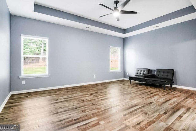 132 Berkleigh Trails Dr, Hiram, GA 30141 - unfurnished room with wood finished floors, a tray ceiling, and ceiling fan