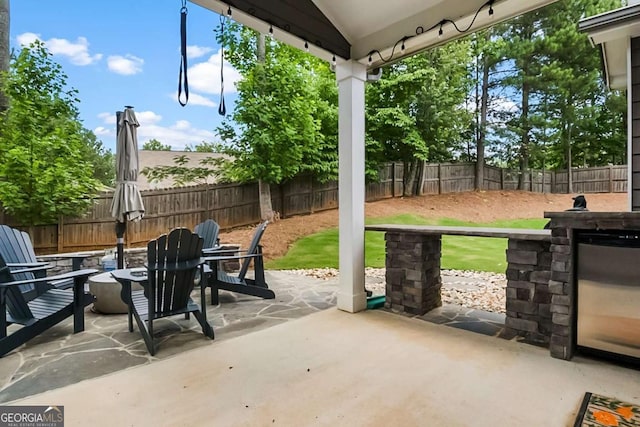 132 Berkleigh Trails Dr, Hiram, GA 30141 - fenced backyard featuring a patio area and a fire pit