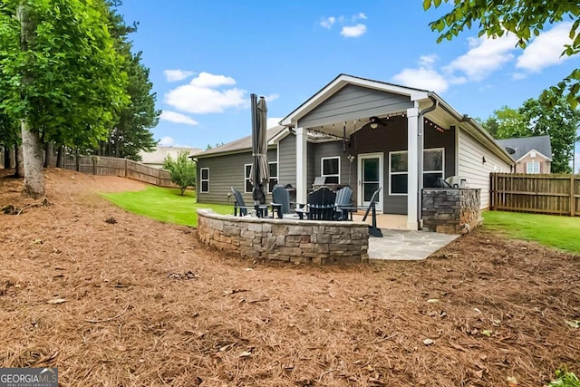 132 Berkleigh Trails Dr, Hiram, GA 30141 - back of house featuring a ceiling fan, a patio area, and a fenced backyard