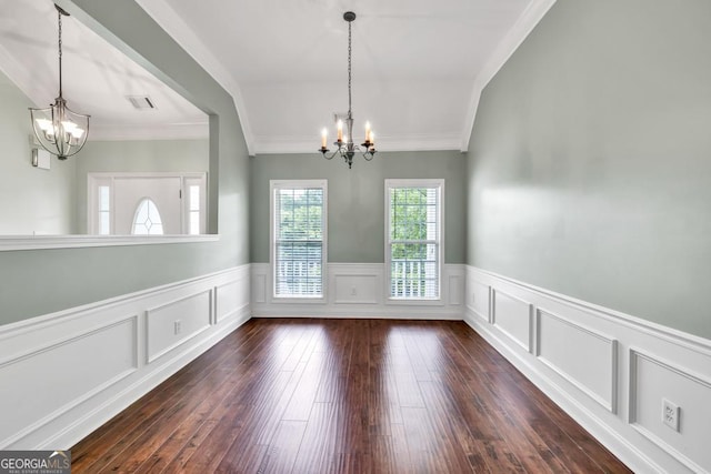 4371 Shag Bark Trl, Gainesville, GA 30507 - unfurnished dining area with a chandelier, dark wood-type flooring, a wainscoted wall, crown molding, and a decorative wall