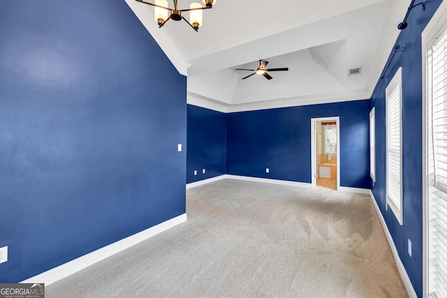 4371 Shag Bark Trl, Gainesville, GA 30507 - carpeted spare room featuring a tray ceiling, a chandelier, and a ceiling fan