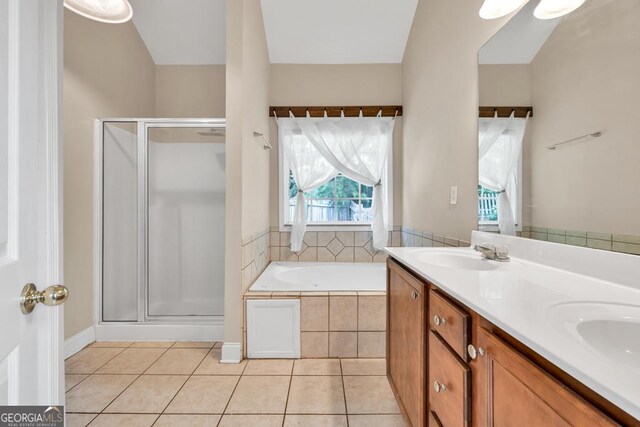4371 Shag Bark Trl, Gainesville, GA 30507 - bathroom with a stall shower, a garden tub, double vanity, and tile patterned floors