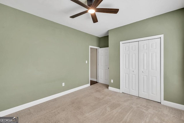 4371 Shag Bark Trl, Gainesville, GA 30507 - unfurnished bedroom featuring carpet, a closet, and a ceiling fan