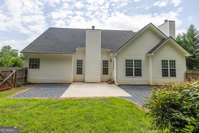 4371 Shag Bark Trl, Gainesville, GA 30507 - back of property featuring a chimney, a patio area, and roof with shingles