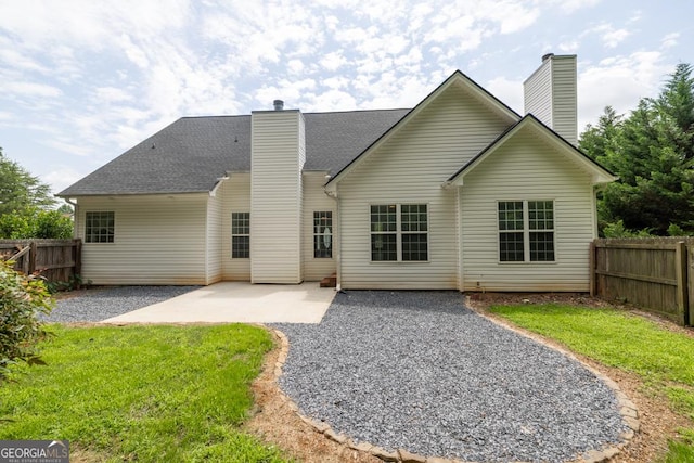 4371 Shag Bark Trl, Gainesville, GA 30507 - back of property with a chimney, a patio, and a shingled roof