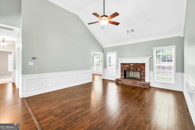 4371 Shag Bark Trl, Gainesville, GA 30507 - unfurnished living room featuring a wainscoted wall, ceiling fan, wood-type flooring, a fireplace, and high vaulted ceiling