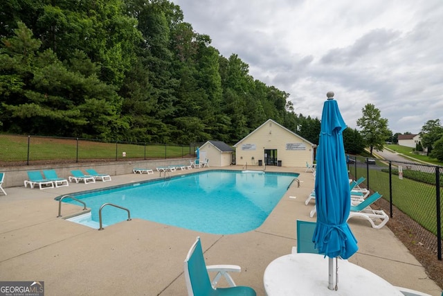 4371 Shag Bark Trl, Gainesville, GA 30507 - community pool with a patio area and an outbuilding