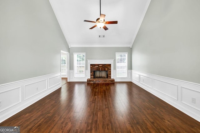 4371 Shag Bark Trl, Gainesville, GA 30507 - unfurnished living room with ornamental molding, a ceiling fan, a brick fireplace, a decorative wall, and a wainscoted wall