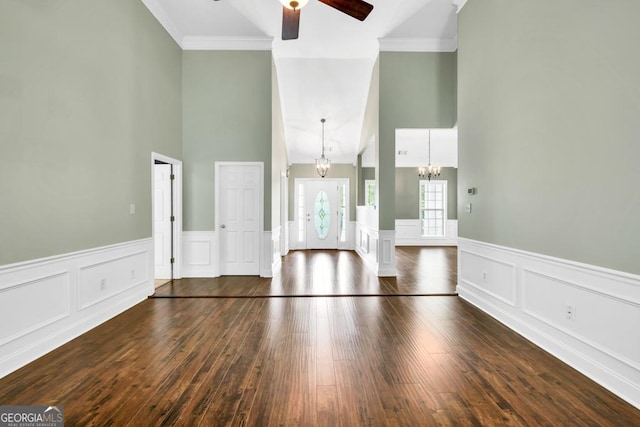 4371 Shag Bark Trl, Gainesville, GA 30507 - unfurnished living room featuring high vaulted ceiling, ceiling fan, dark wood finished floors, a chandelier, and crown molding