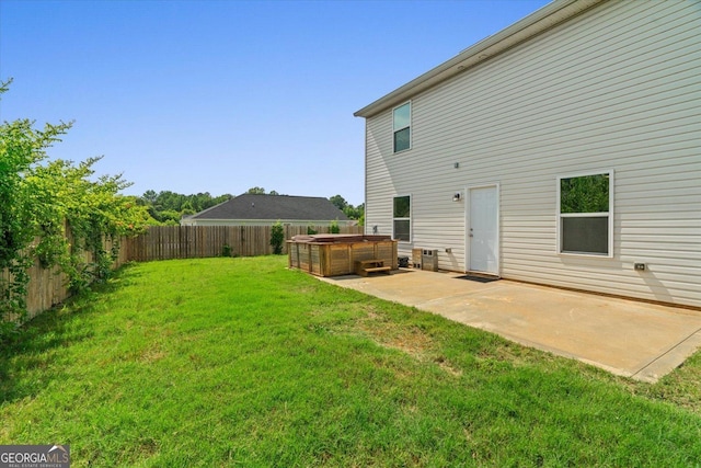 104 Middleton Ct, Chatsworth, GA 30705 - rear view of property featuring a hot tub, a patio, and a fenced backyard