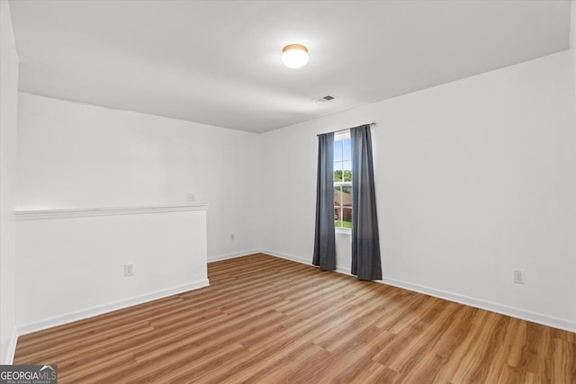104 Middleton Ct, Chatsworth, GA 30705 - empty room with wood finished floors and baseboards
