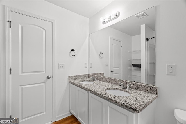 104 Middleton Ct, Chatsworth, GA 30705 - full bathroom with double vanity and wood finished floors