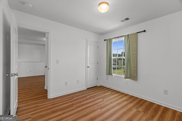 104 Middleton Ct, Chatsworth, GA 30705 - unfurnished bedroom featuring light wood-type flooring