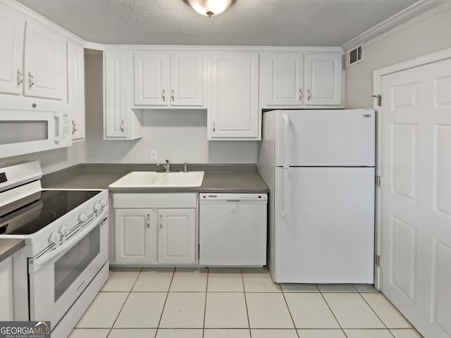 1480 D NE Pine Log Rd Unit D, Conyers, GA 30012 - kitchen with white appliances, white cabinetry, light tile patterned floors, and a textured ceiling
