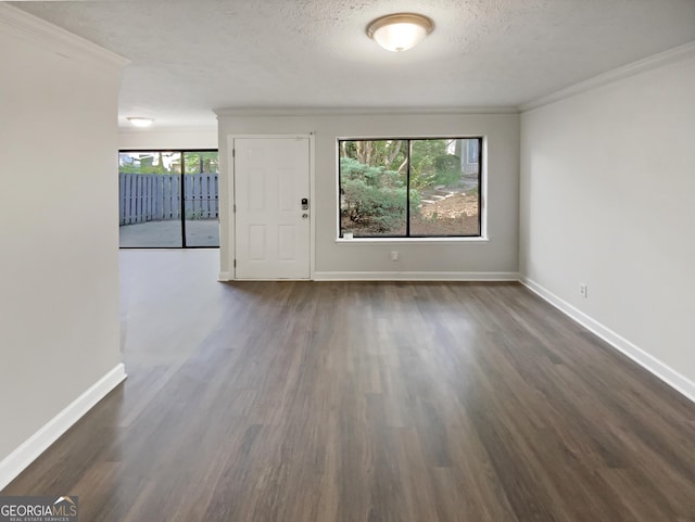 1480 D NE Pine Log Rd Unit D, Conyers, GA 30012 - empty room featuring dark wood finished floors, crown molding, and a textured ceiling