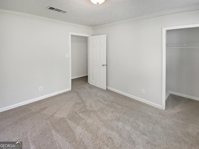 1480 D NE Pine Log Rd Unit D, Conyers, GA 30012 - unfurnished bedroom with carpet, a closet, and ornamental molding