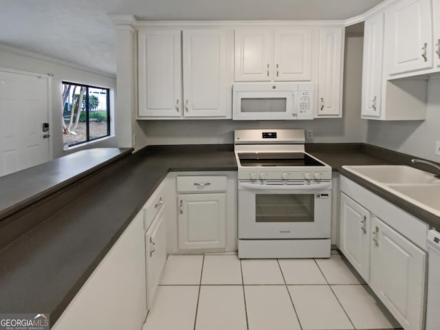 1480 D NE Pine Log Rd Unit D, Conyers, GA 30012 - kitchen with white appliances, dark countertops, white cabinetry, light tile patterned flooring, and ornamental molding