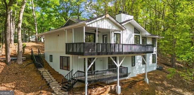2945 Thompson Mill Rd, Gainesville, GA 30506 - back of property with stairs, a ceiling fan, a chimney, and a deck