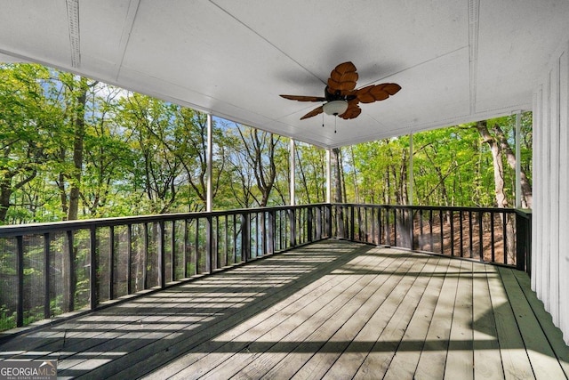 2945 Thompson Mill Rd, Gainesville, GA 30506 - deck featuring a ceiling fan and view of wooded area