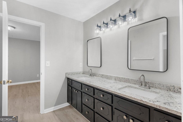 2945 Thompson Mill Rd, Gainesville, GA 30506 - bathroom with wood finished floors and double vanity