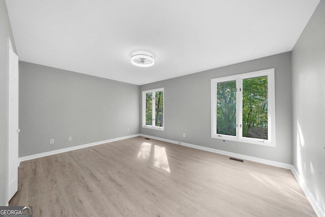 2945 Thompson Mill Rd, Gainesville, GA 30506 - unfurnished room featuring wood finished floors and baseboards