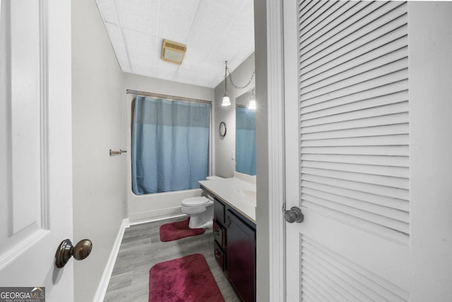 2945 Thompson Mill Rd, Gainesville, GA 30506 - full bathroom with shower / bath combo, vanity, and wood finished floors