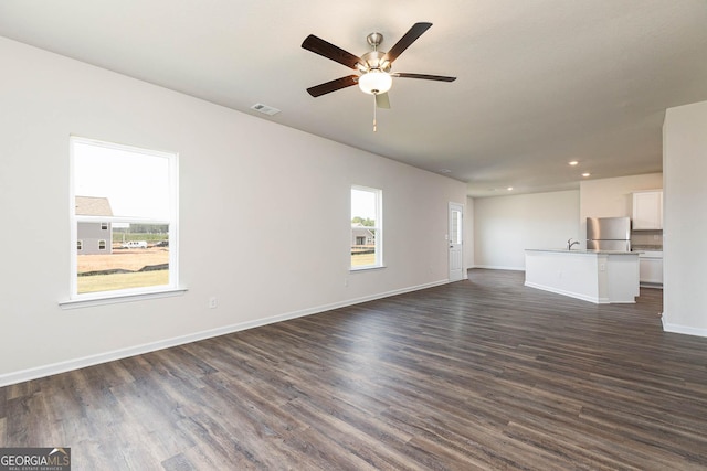 288 Oliver Dr, Locust Grove, GA 30248 - unfurnished living room featuring ceiling fan, dark wood-style flooring, and recessed lighting
