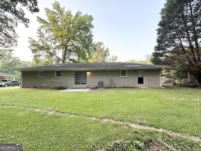 3403 Linda Dr, Lithia Springs, GA 30122 - back of property with a patio and a lawn