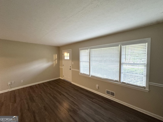 3403 Linda Dr, Lithia Springs, GA 30122 - empty room with dark wood-type flooring and a textured ceiling