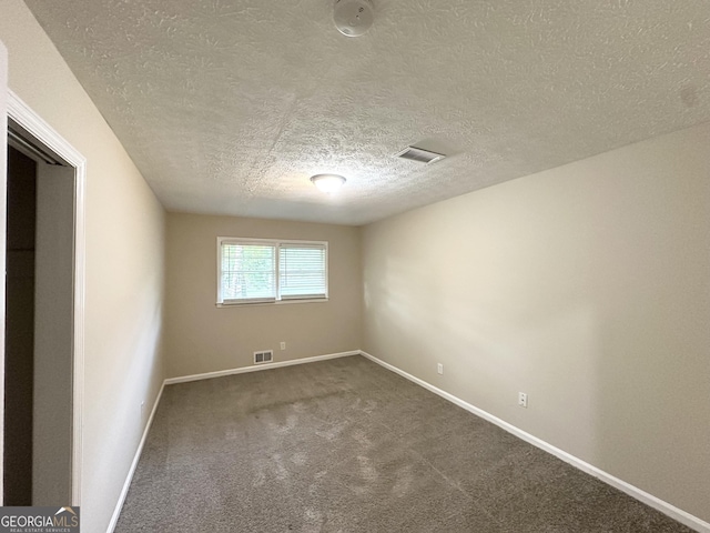 3403 Linda Dr, Lithia Springs, GA 30122 - carpeted empty room featuring a textured ceiling and baseboards