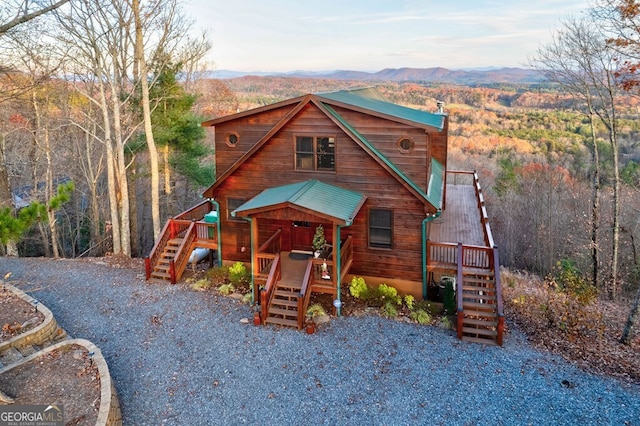 588 Tower Rd, Mineral Bluff, GA 30559 - rustic home with stairway, a deck with mountain view, and a wooded view