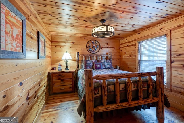 588 Tower Rd, Mineral Bluff, GA 30559 - bedroom with light wood-style floors, wooden walls, and wooden ceiling