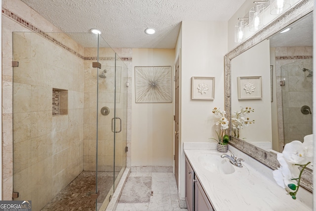 4467 Pineridge Cir, Atlanta, GA 30338 - bathroom with vanity, a shower stall, a textured ceiling, and recessed lighting
